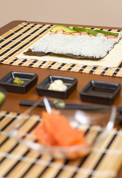 istock Japanese sushi with rice ready to roll on a table 475474641