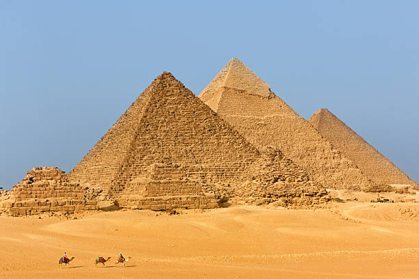 istock Pyramids of Giza and Camel Riders, Egypt 475476496