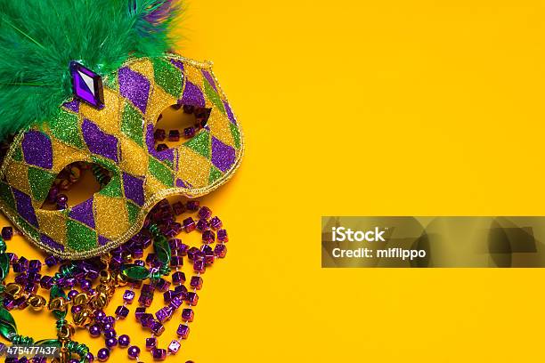 Colorful Mardi Gras Or Venetian Mask On A Yellow Stock Photo - Download Image Now - Mardi Gras, Backgrounds, Mask - Disguise