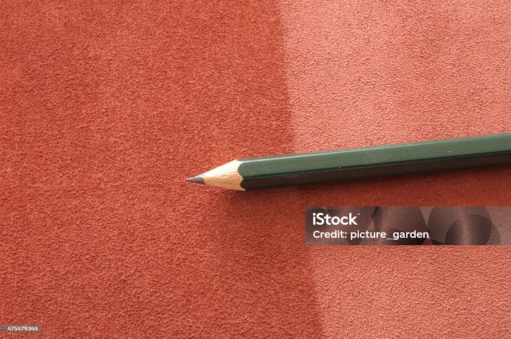 pencil on leather background pencil on brown red suede velours leather 2015 Stock Photo