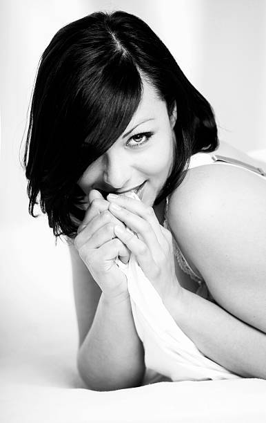 istock Beautiful woman laying in bed 475479766