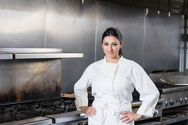 istock Female chef in a commercial kitchen 475480070