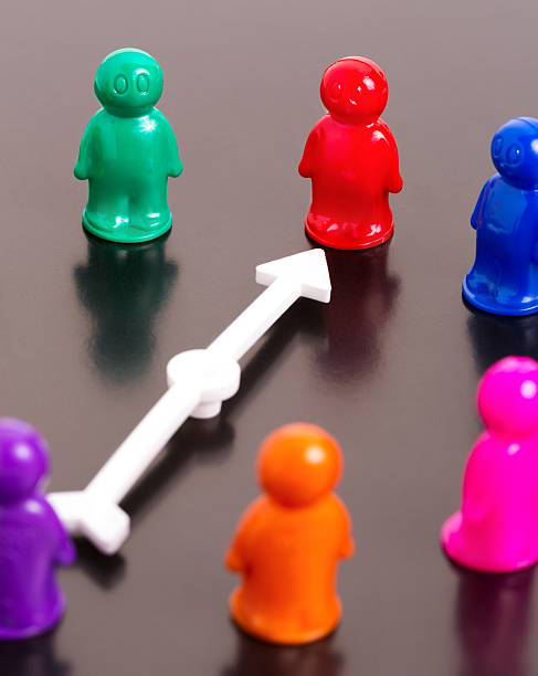 istock group of toy peoples and white arrow 475481073