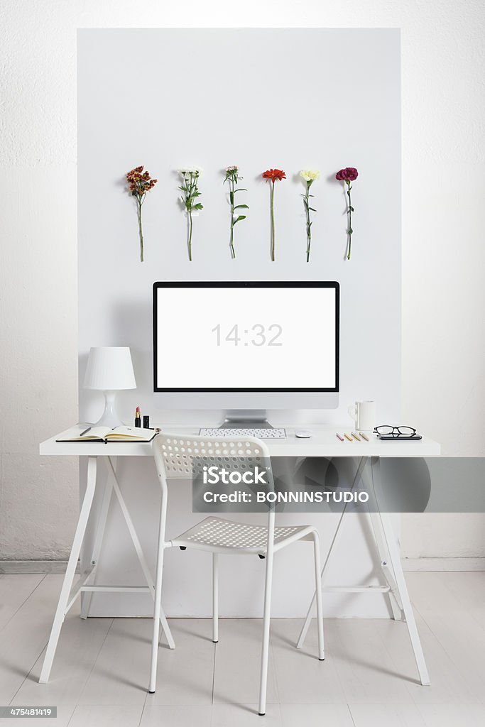 White desk with spring environment. White creative office. Computer Stock Photo