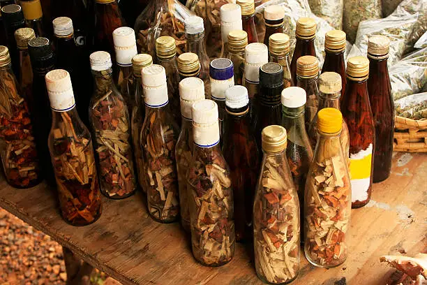 Display of bottles with "Mama Juana" in small village, Samana Peninsula, Dominican Republic