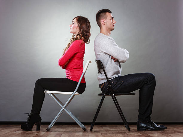 istock Young couple after quarrel sitting back to back 475484134