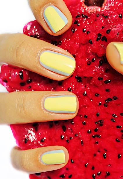 istock creative design manicure on fingernails, hand holding dragon fru 475487004