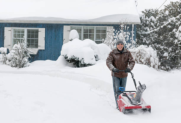 istock Man clearing driveway with snowblower 475488807