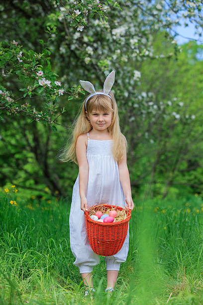 istock Little girl wearing bunny ears 475492834