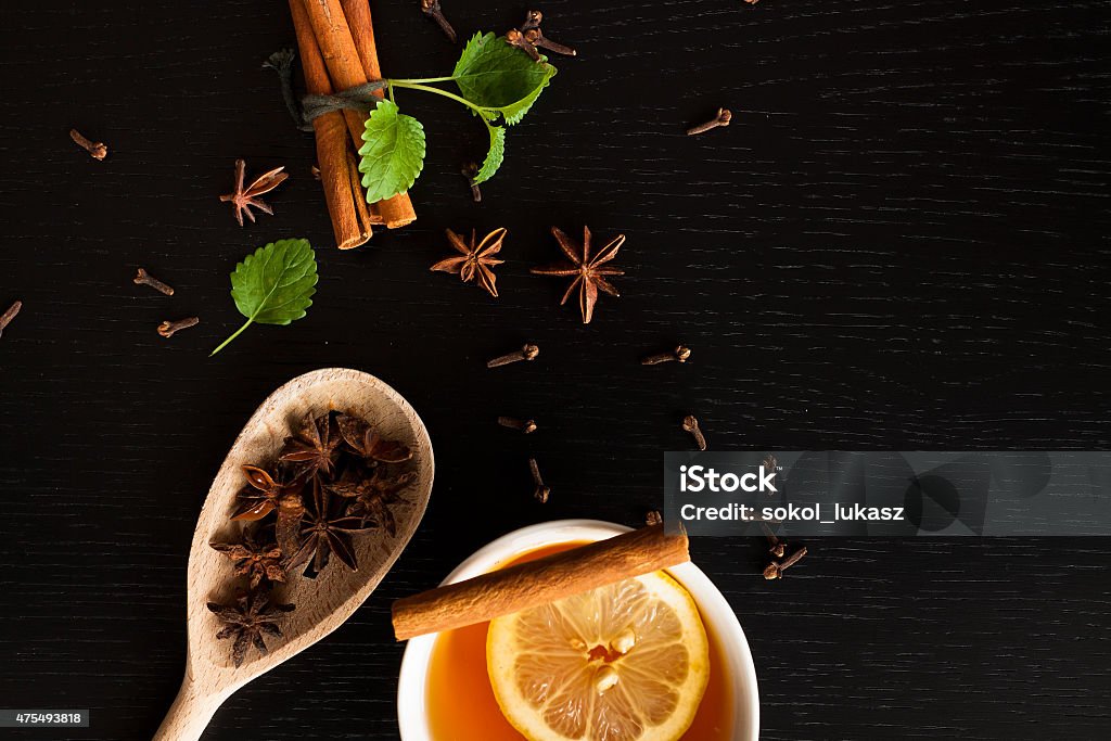 Anise stars, tea and cinnamon sticks on wood Close up of anise star, tea and cinnamon stick on wooden table. 2015 Stock Photo