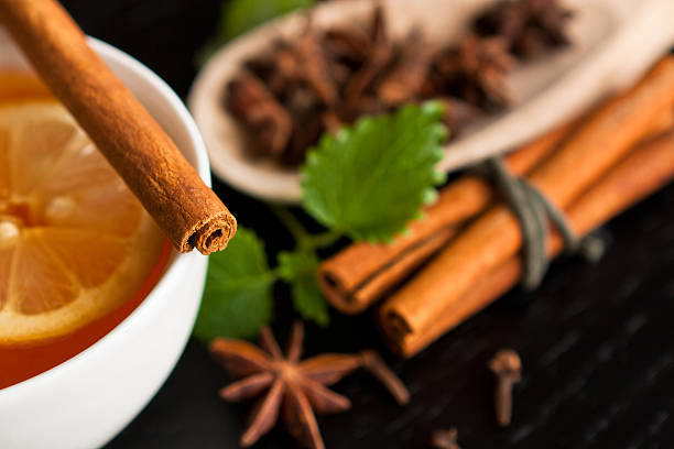 istock Anise stars, tea and cinnamon sticks on wood 475493824
