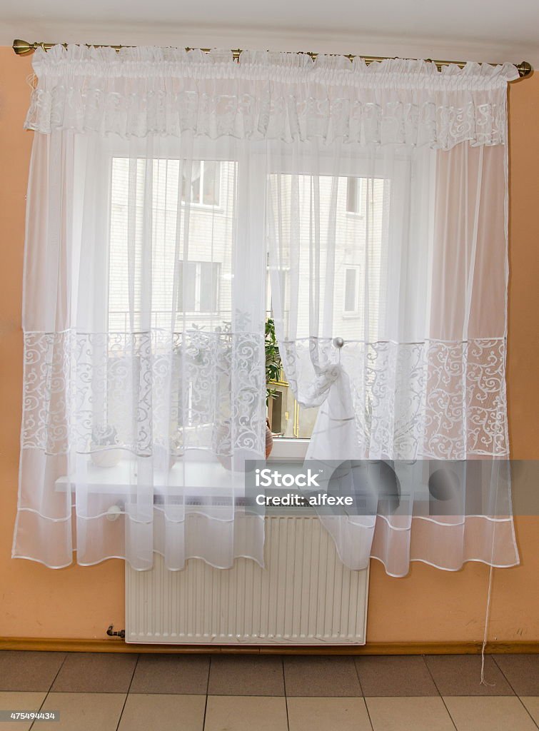 light fabric curtains in sunshine day. draperies on windows light fabric curtains in sunshine day. draperies on windows at  kitchen 2015 Stock Photo