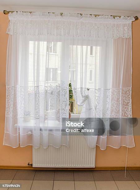 Light Fabric Curtains In Sunshine Day Draperies On Windows Stock Photo - Download Image Now