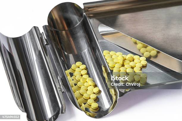 Yellow Pills On Counting Tray Stock Photo - Download Image Now - Counting, Pill, 2015