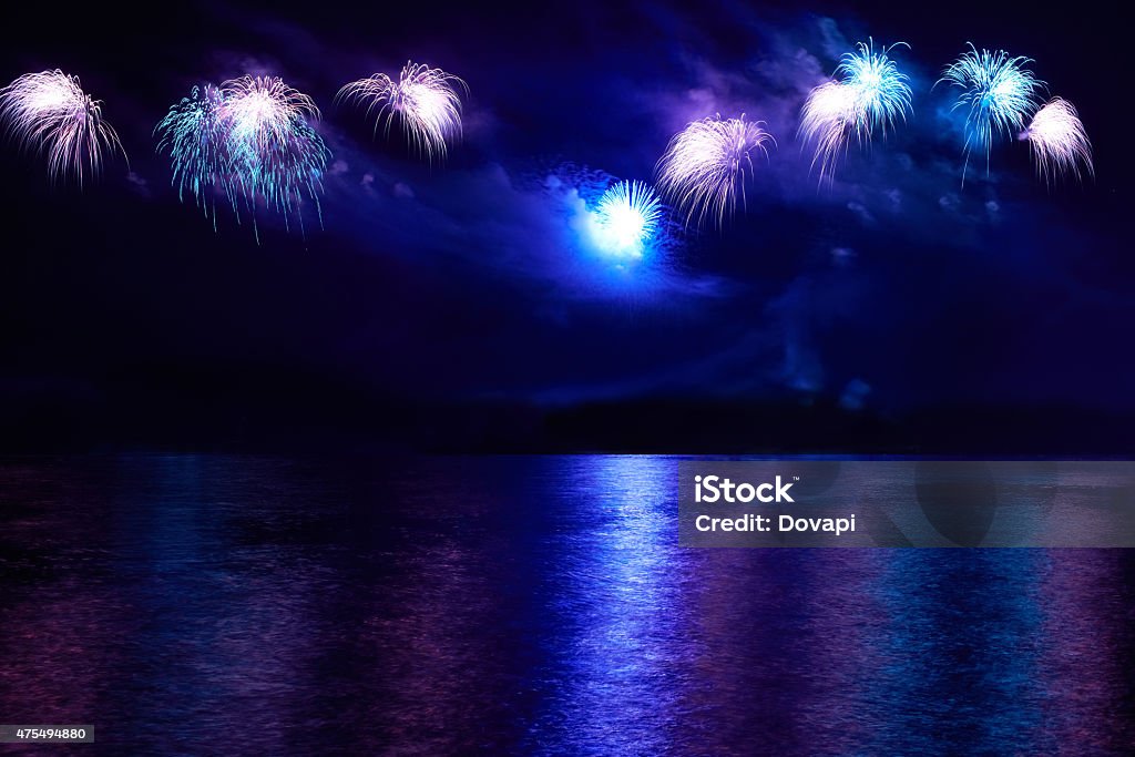 Colorful fireworks Blue colorful fireworks on the black sky background 2015 Stock Photo