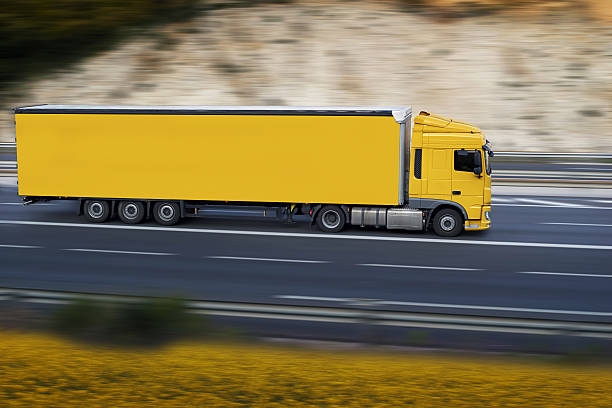 yellow semi truck stock photo