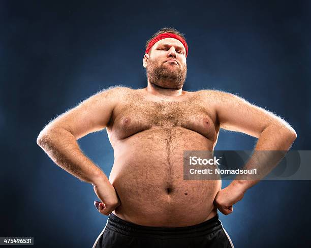 Fat Man Imitating Muscular Build Stock Photo - Download Image Now - Men, Overweight, Naked