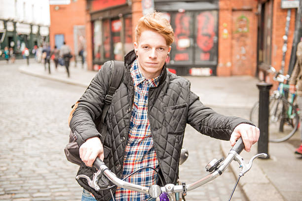istock Hipster with Bike in city 475497962