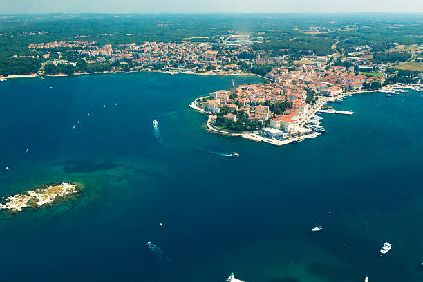 Aerial view of Porec, Croatia. Porec, the biggest tourist center of Istria and Croatia, is located 60 km from the airport on the west coast of Istria in the lagoon of the same name 25 km. Porec is one of the most visited cities in Croatia as a tourist infrastructure of the city provides a very high level.