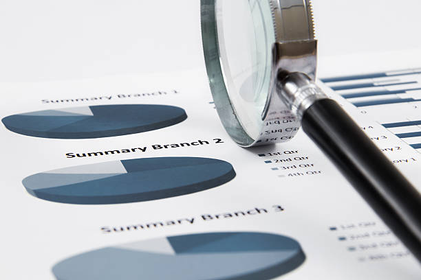 istock magnifying glass on the business report 475500343