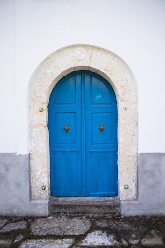 Old wooden door in blue color.
