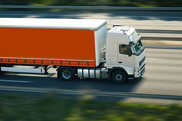 orange semi truck stock photo