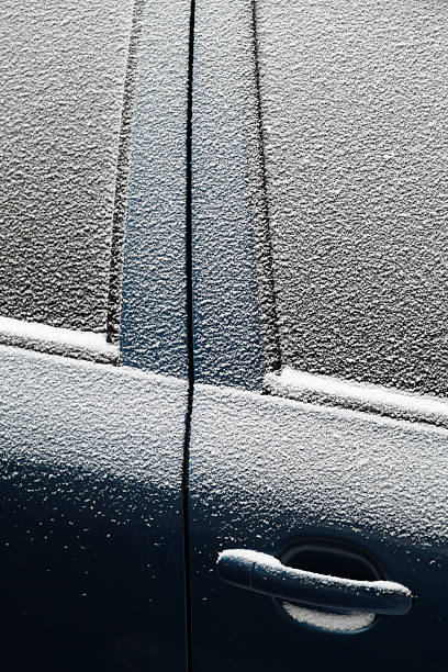 istock Snowy car door 475502815