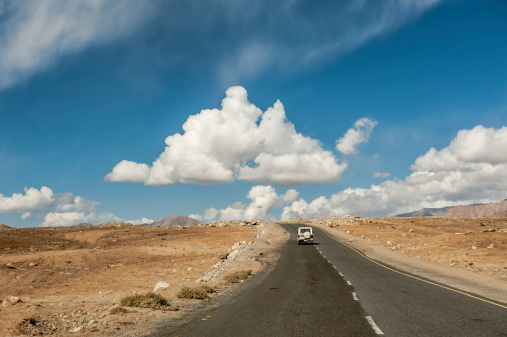 Ladakh, India - October 12,2012: Tourist car on the mountain road between Manali and Leh in Ladakh, India.