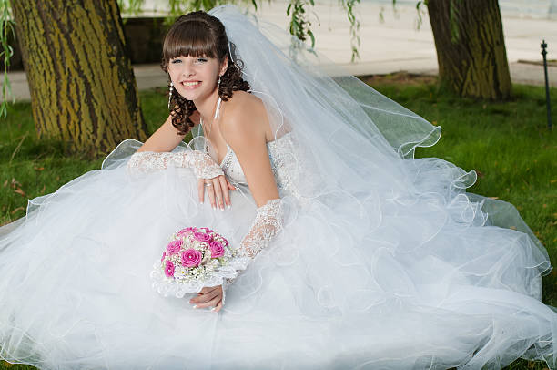 istock Young beautiful bride in wedding dress 475506259