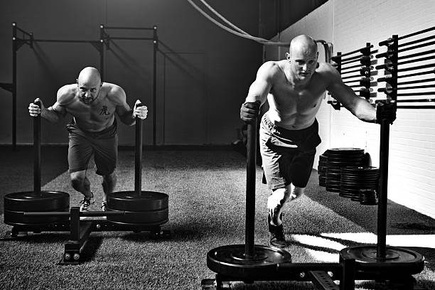 istock two muscled man working out in gym 475507020