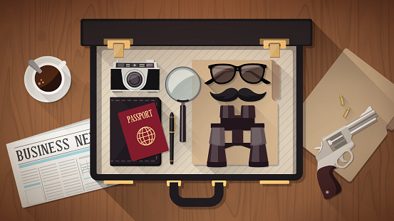 Detective vintage briefcase with camera, magnifier, sunglasses, passport, moustaches, revolver and newspaper on a desktop, top view