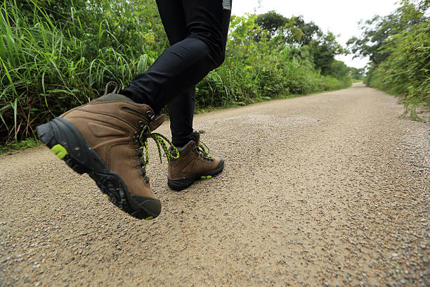 istock woman hiking on forest trail 475507824