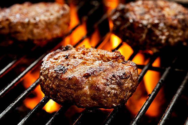 Burgers On The Grill stock photo