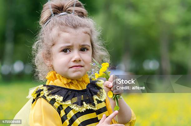 Beautiful Girl In A Suit Bee At Park Happy Child Stock Photo - Download Image Now - 2015, Agricultural Field, Baby - Human Age