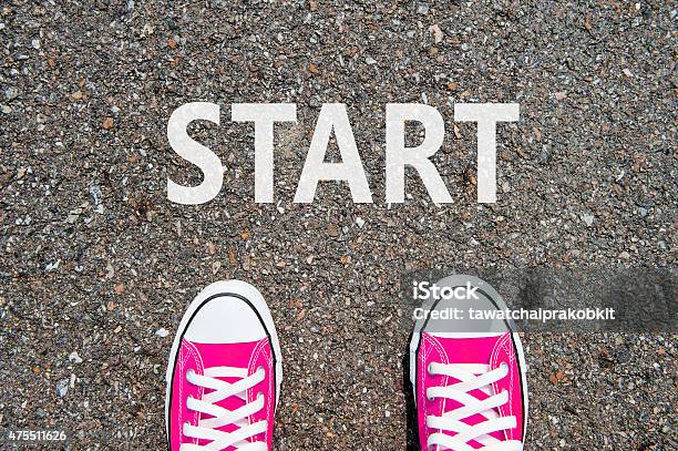 Feet Concept With Pink Sneakers On Black Background Stock Photo - Download Image Now