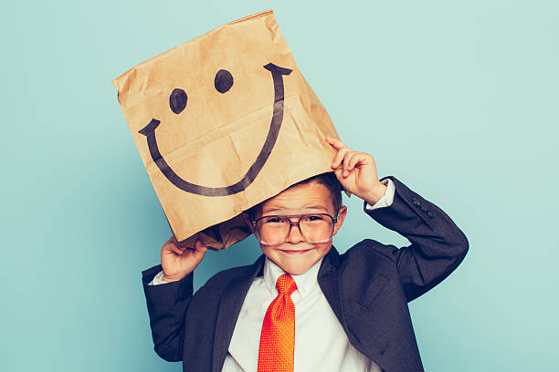 istock Young Boy Businessman Wears Happy Face 475511934