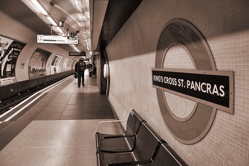 London, United Kingdom - May 15, 2012: Travelers wait at King's Cross underground station on May 15, 2012 in London. London Underground is the 11th busiest metro system worldwide with 1.1 billion annual rides.