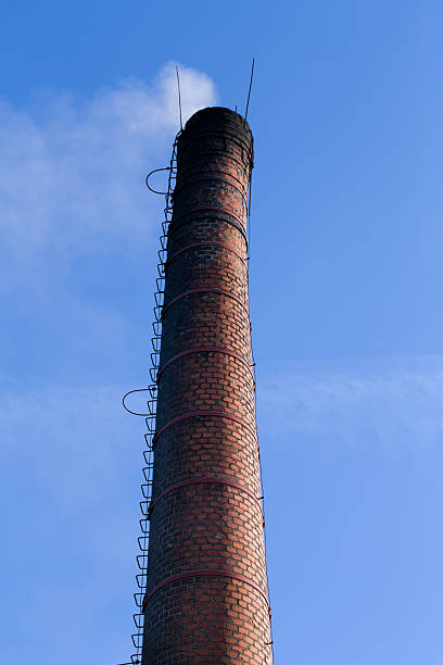 istock Polluting smoke coming out of chimney 475518184