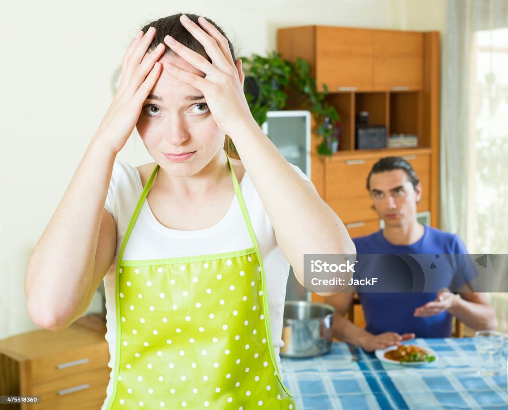 girl serving food her man at table Sad girl serving food her beloved man at table 2015 Stock Photo