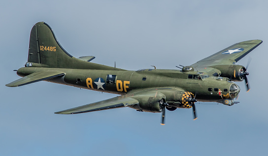 Duxford, UK - May 23, 2015: A Boeing B17G Flying Fortress WWII bomber aircraft of the US Army Air Corps in flight over Cambridgeshire, England. 