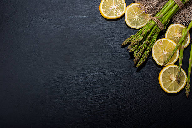 Asparagus on a dark surface. Food background