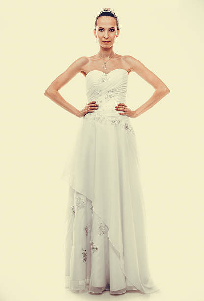 istock Full length bride in white wedding gown 475519446