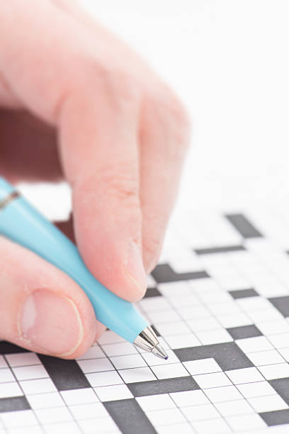 istock Crossword puzzle and pen 475520126