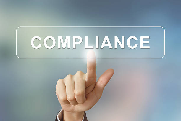istock business hand clicking compliance button on blurred background 475520150