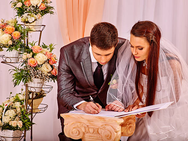 Groom and bride register marriage stock photo