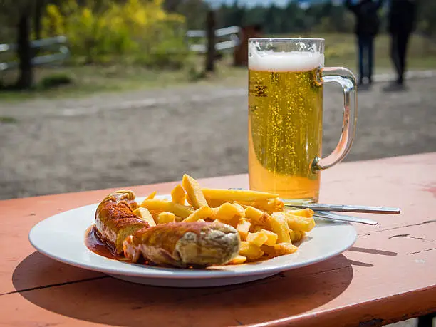 Photo of Currywurst and beer