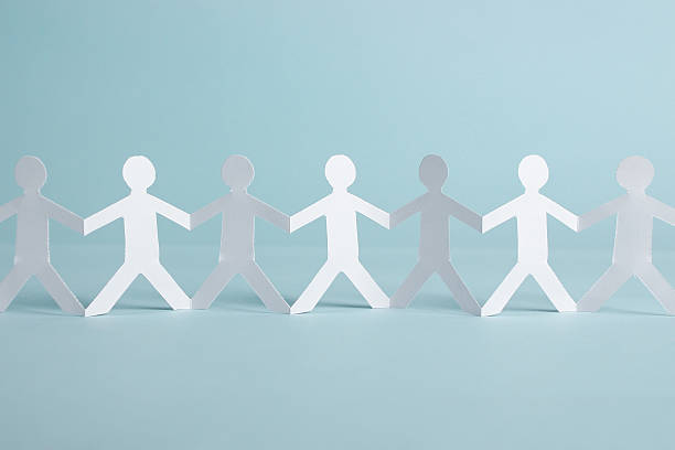 istock Group of people holding hands 475523944