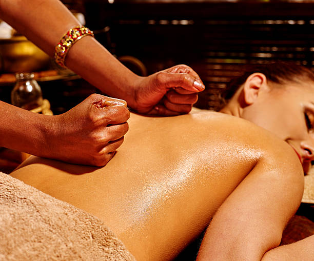 istock Woman having Ayurvedic spa treatment 475526118