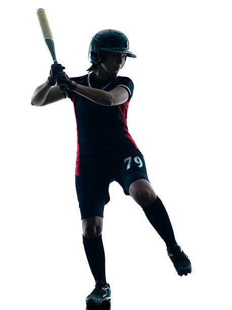 istock woman playing softball players silhouette isolated 475527044