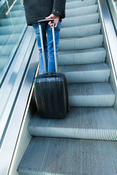 istock traveler with a trolley bag 475529293